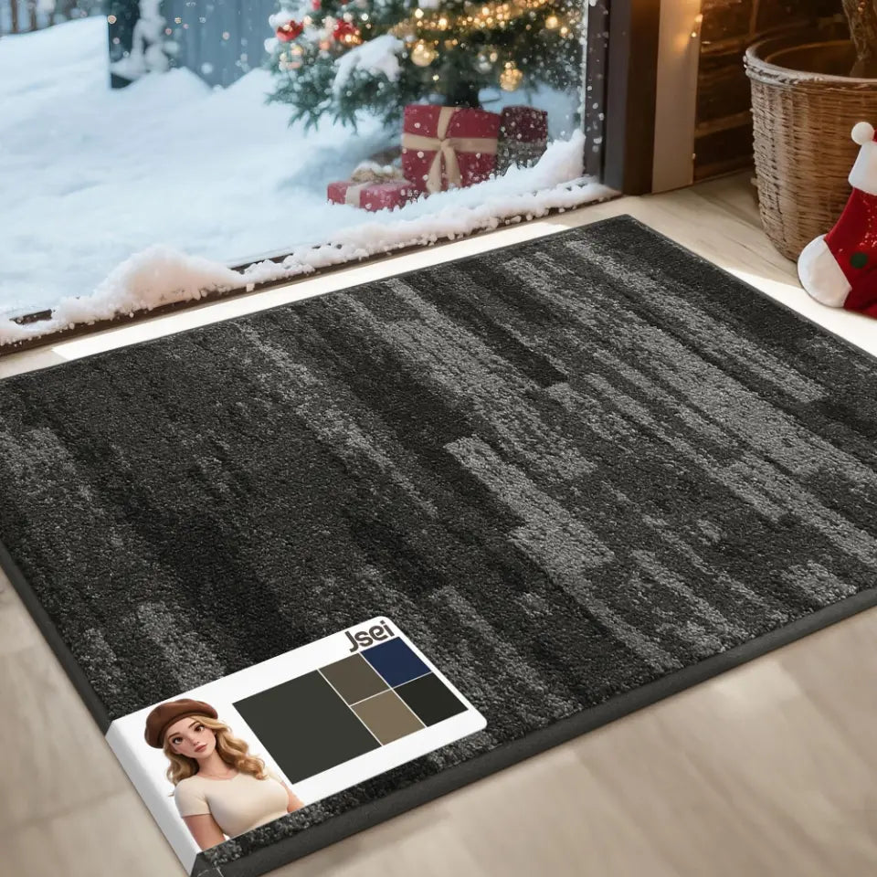 Light grey doormat on a wooden floor in front of a snowy window with Christmas decorations.
